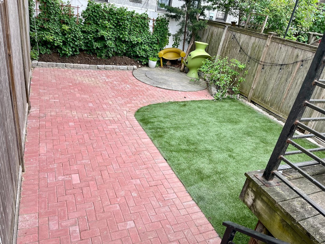 Red Brick Patio Meet Plush Green Turf and Cozy Corner Décor-$7,150