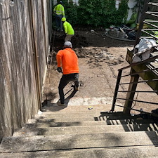 Red-Brick-Patio-Meet-Plush-Green-Turf-and-Cozy-Corner-Dcor-7150 1